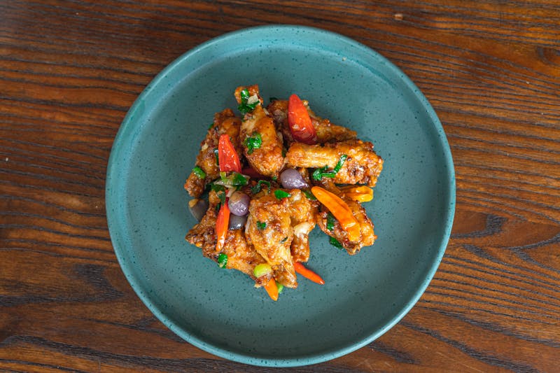 Buffalo wings with celery and blue cheese dipping sauce